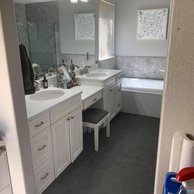 double vanity cabinet and countertops with sitting area