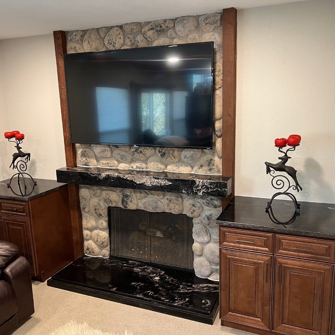 stone mantle and countertop cabinets